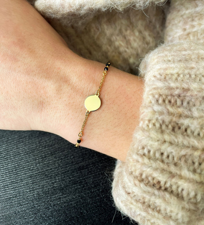 Gold-plated bracelet with full circle and black stones