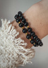 Bracelet on an elastic band with khaki cubic zirconia and natural pearl